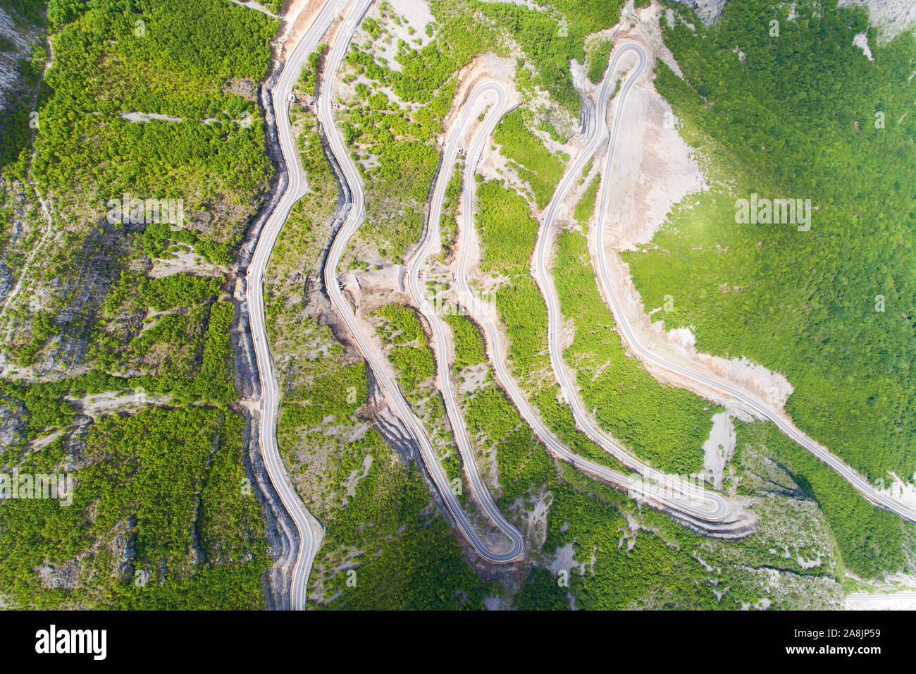 aerial view of Serpentine road in Albanian mountains near Rrapsh Stock