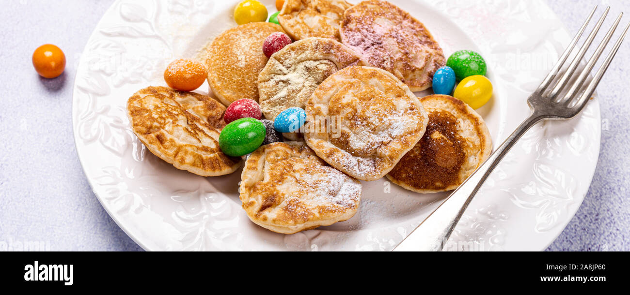 Dutch mini pancakes called poffertjes Stock Photo