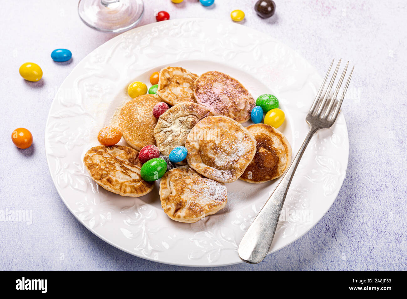 Dutch mini pancakes called poffertjes Stock Photo