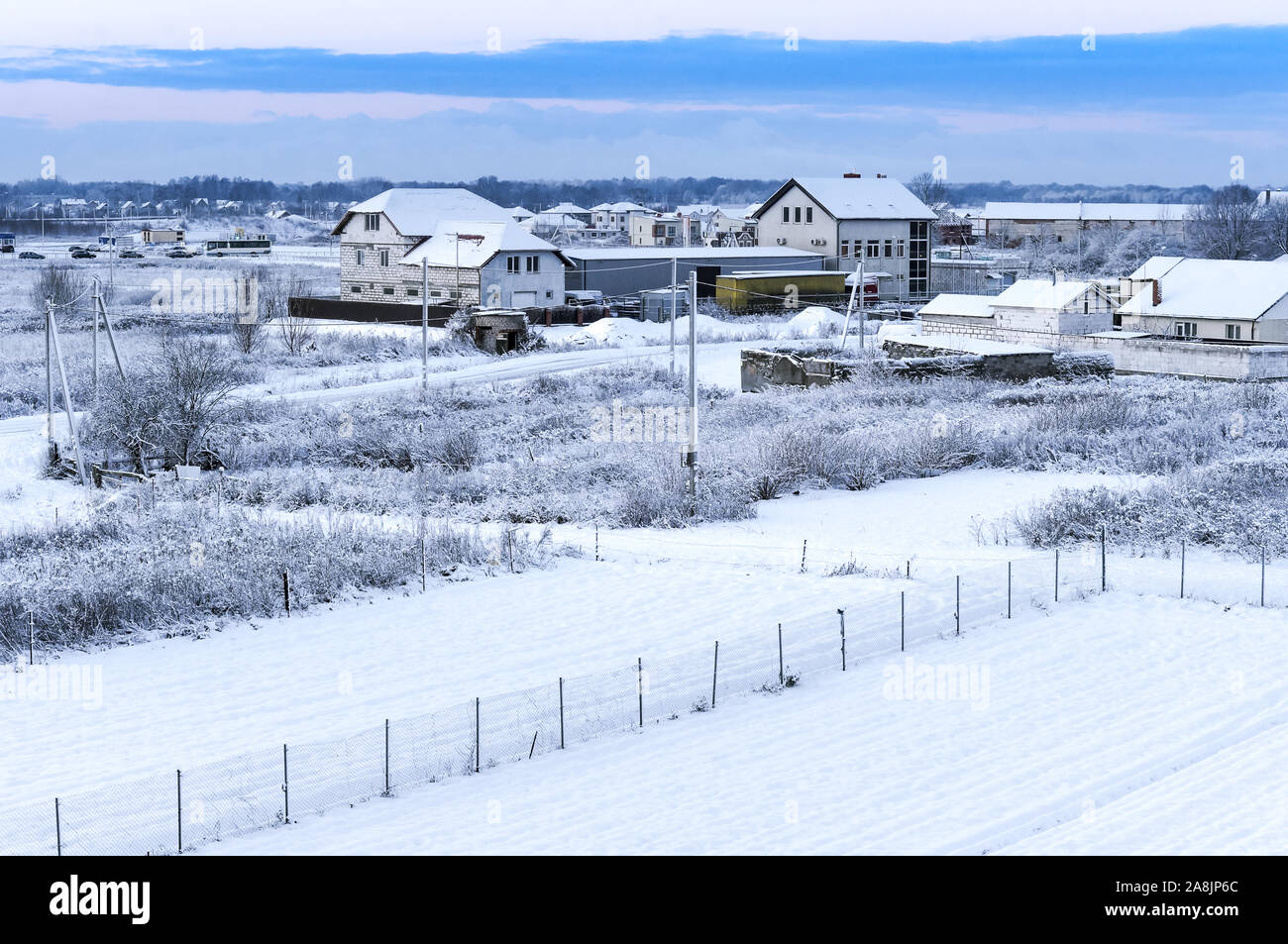 rural landscape in winter, houses and fields covered with snow Stock ...