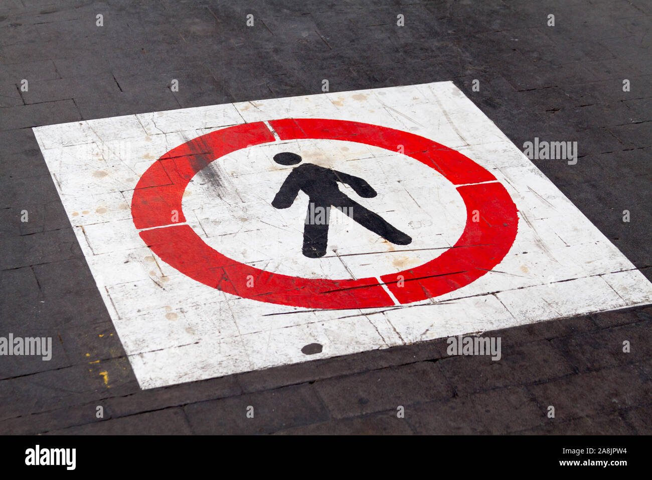 Pedestrian sign on a pavement in Italy Stock Photo