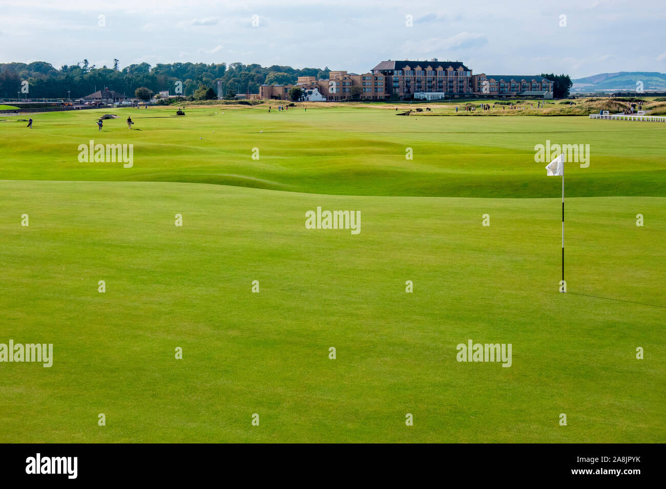 St. Andrews, Scotland/UK-24AUG2019: Golf course of St. Andrews, GOLFINO Clubhouse St. Andrews on the background. Stock Photo