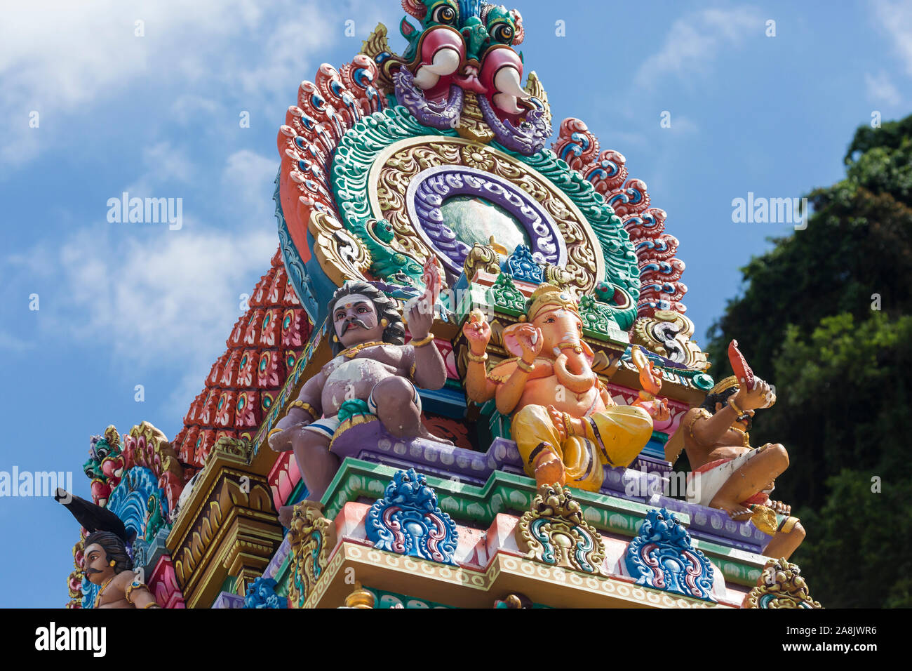 Brightly colored Hinduthemed statues outside of Batu Caves in Kuala
