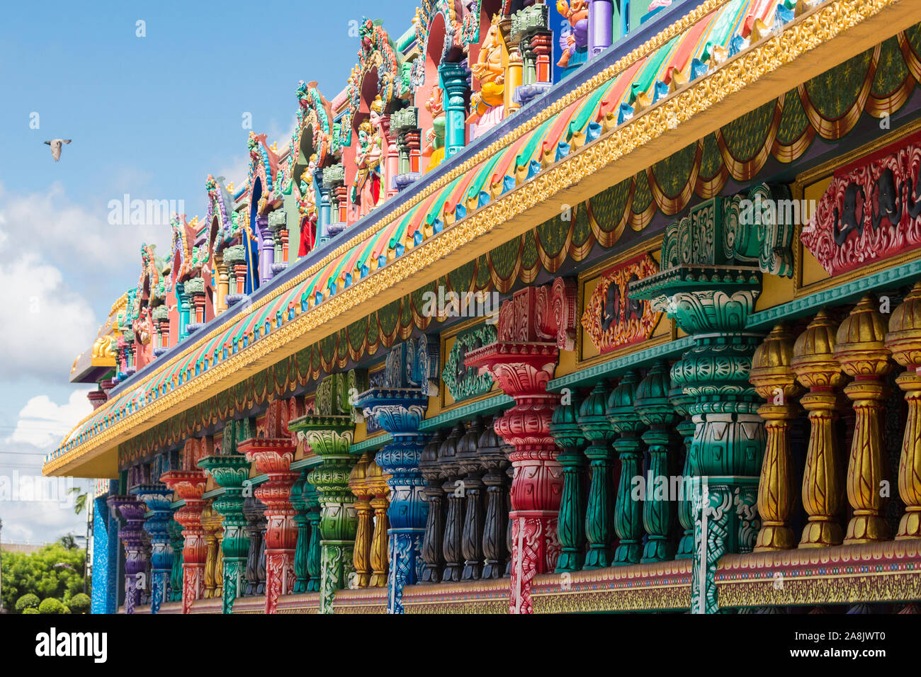 Brightly colored Hinduthemed statues outside of Batu Caves in Kuala