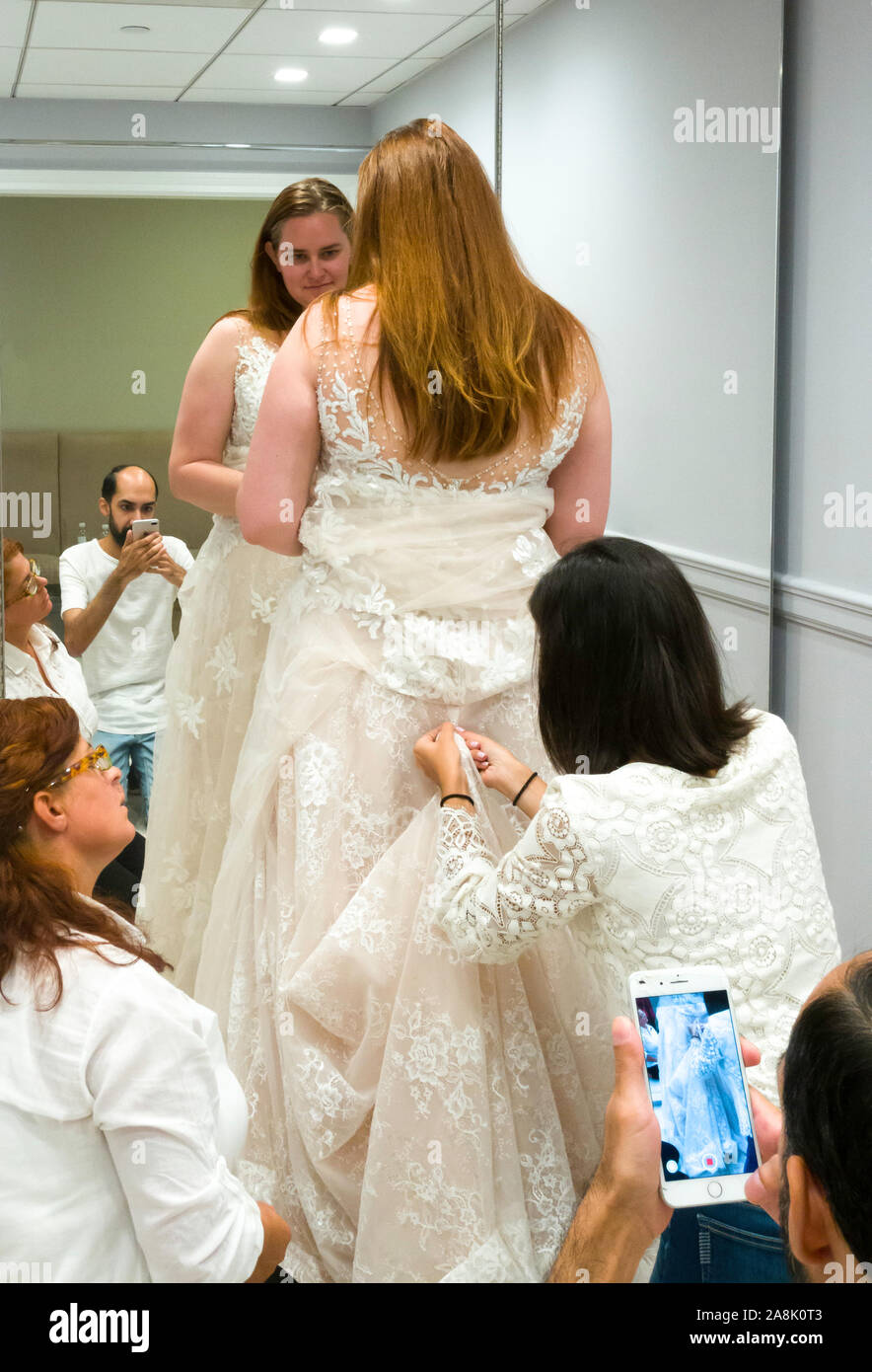 Bride Trying on Her Dress at Kleinfeld Bridal, upscale bridal boutique