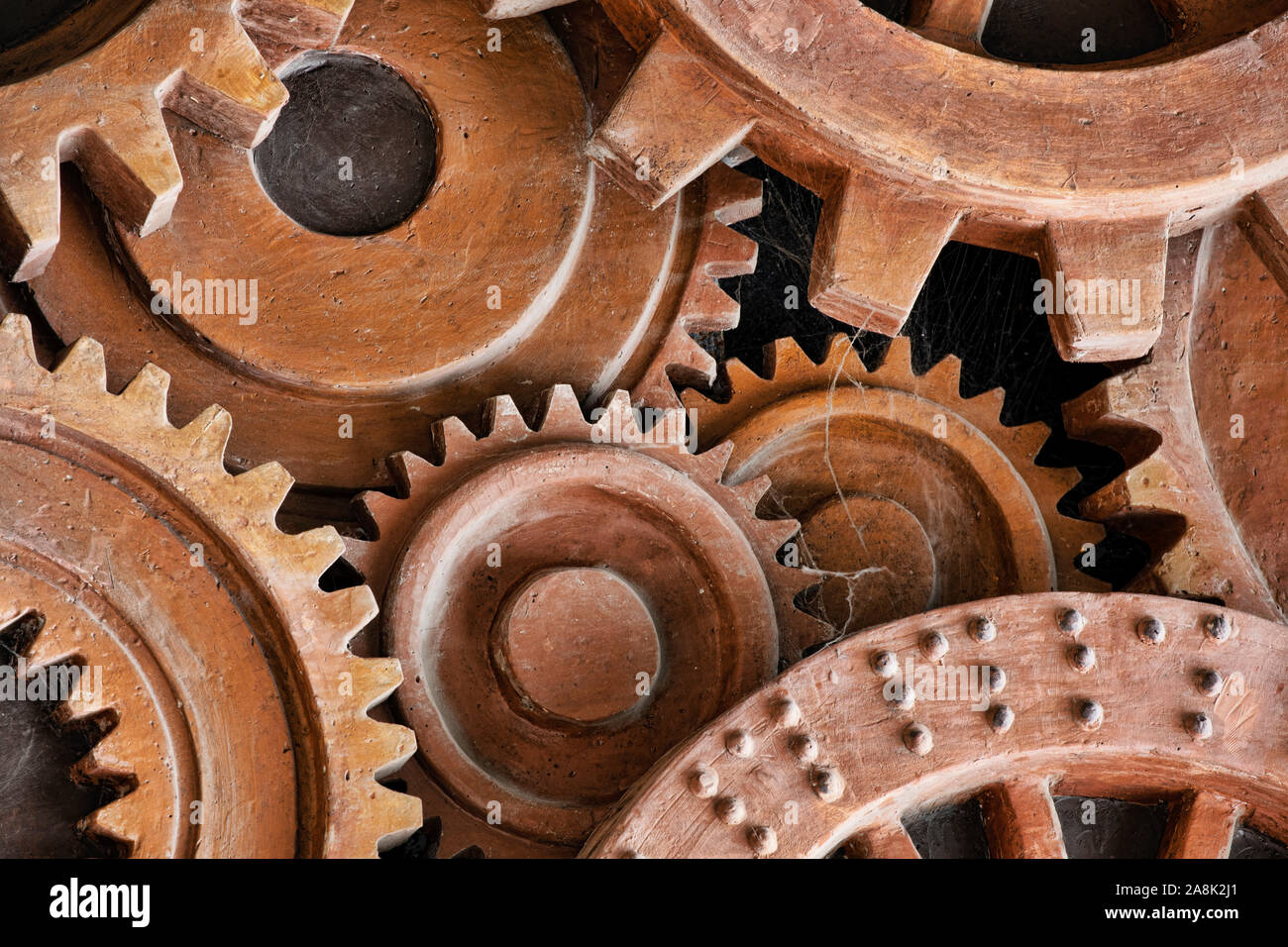 Grunge gears and wheels create an industrial steampunk background. Machine parts, and mechanical machinery make for a nice grunge look. Stock Photo