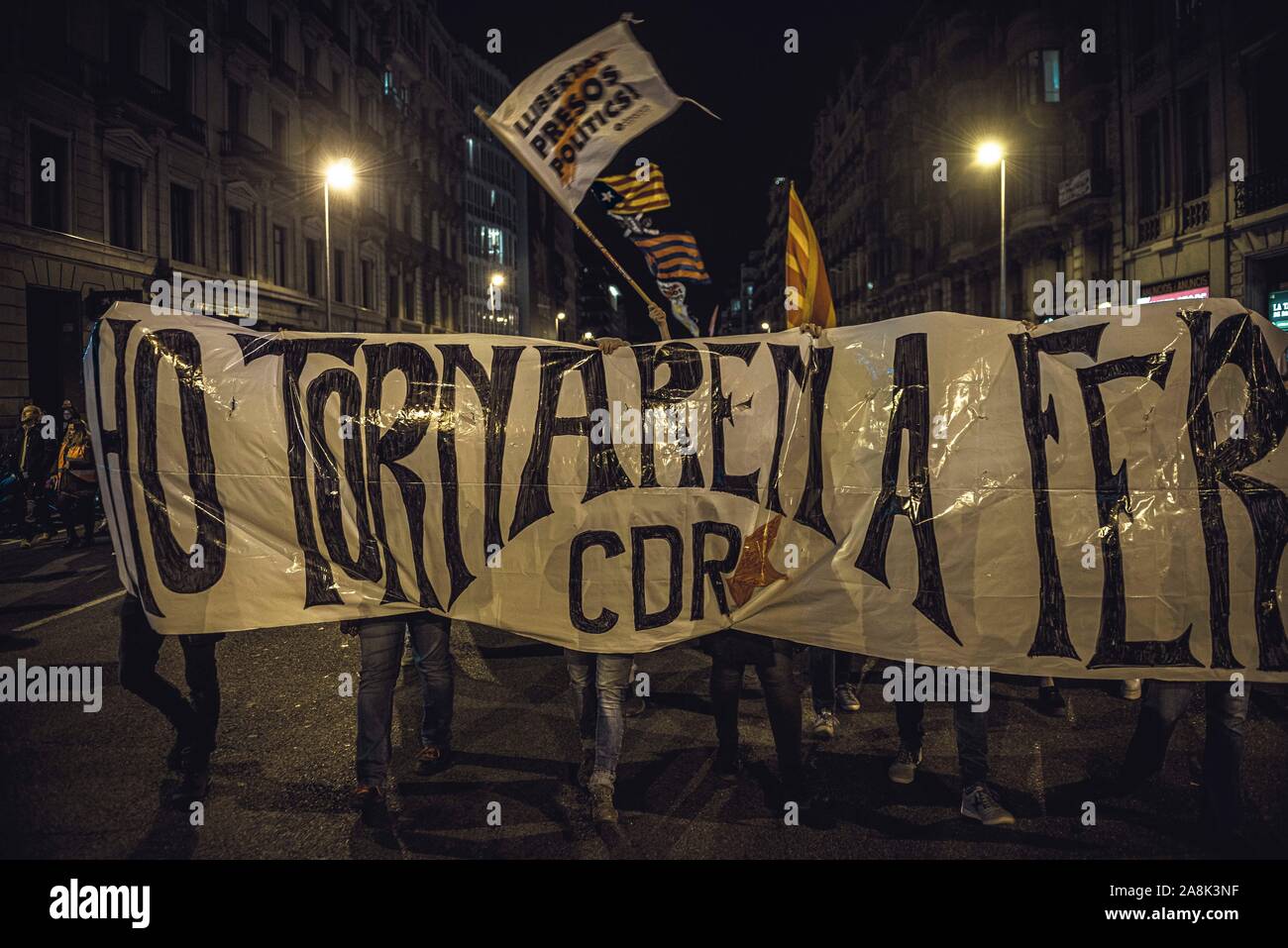 Barcelona, Spain. 9 November, 2019:  Members of Barcelona's CDR (Committee for the Defense of the Republic) march behind their banner reading 'we will do it again' protesting the Supreme Court's verdict against 9 Catalan leaders over their role in a banned referendum on secession in October 2017 as an act of civil disobedience against the central electoral commission during election silence the day before a general election. Stock Photo
