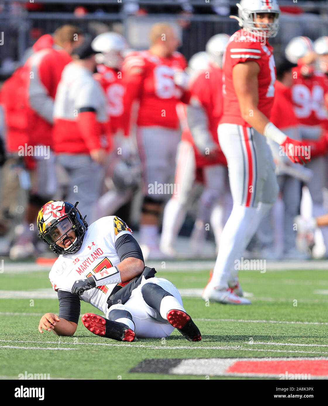 November 9, 2019: Maryland Terrapins quarterback Josh Jackson (17) sits on the ground after being hit by Ohio State Buckeyes defensive lineman Alex Williams (17). Penalty on the play, roughing the passer. during the NCAA football game between the Maryland Terrapins & Ohio State Buckeyes at Ohio Stadium in Columbus, Ohio. JP Waldron/Cal Sport Media Stock Photo