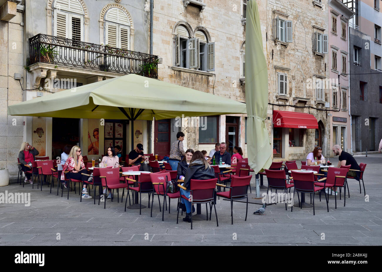 Outside eating at restaurant, cafe, Enoteca Istriana, Near the Temple of Augustus and the Forum in Pula, Croatia Stock Photo