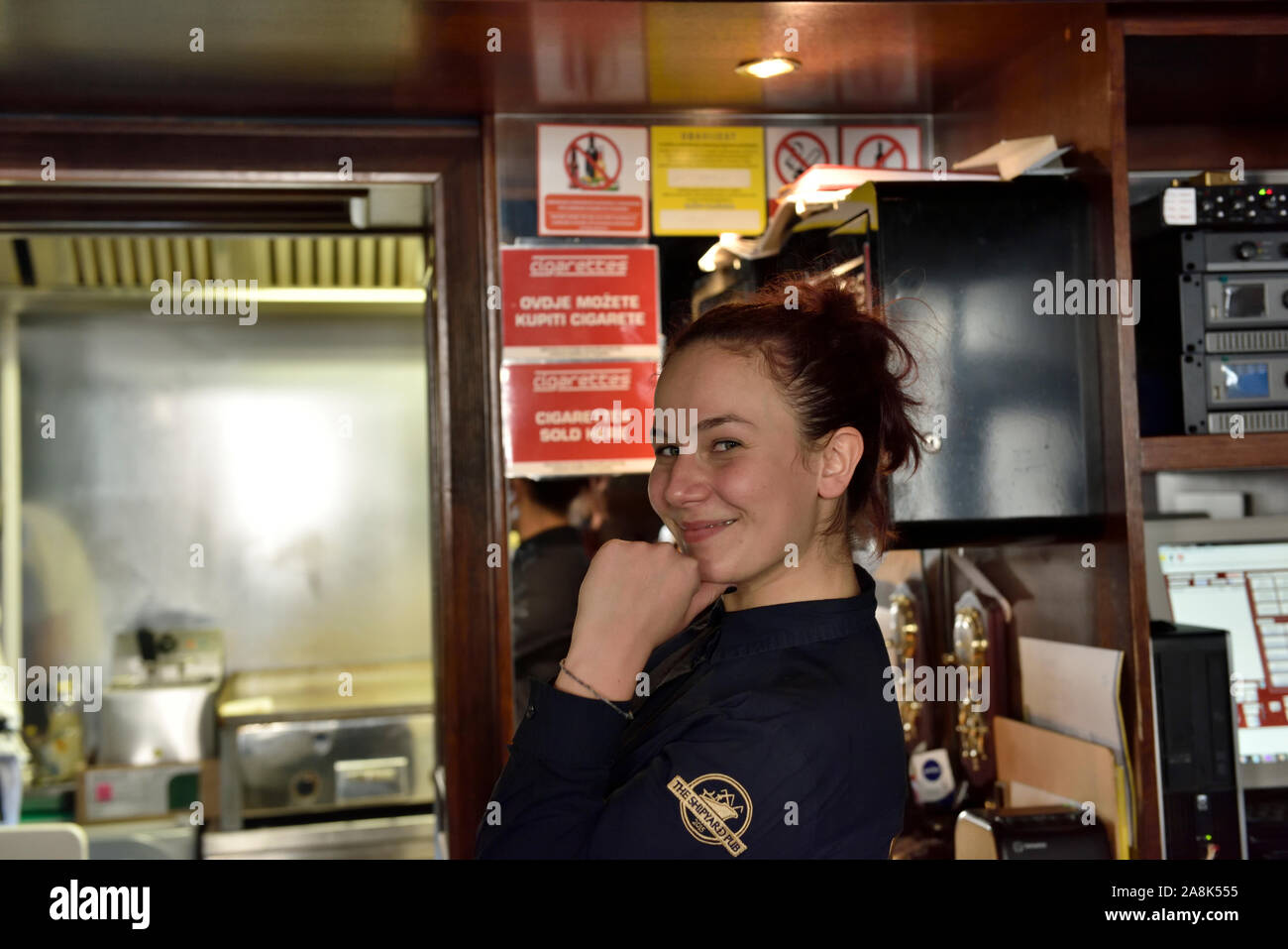 Attractive young waitress in Croatian bar (Riva) Pula, Istria, Croatia, Stock Photo
