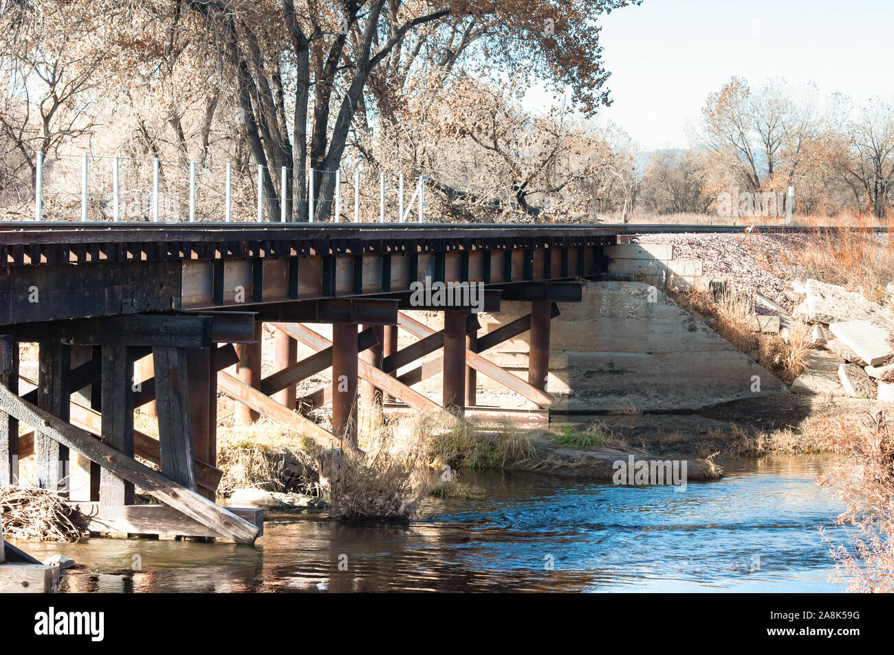 Railroad bridge over the Cache La Poudre river Stock Photo