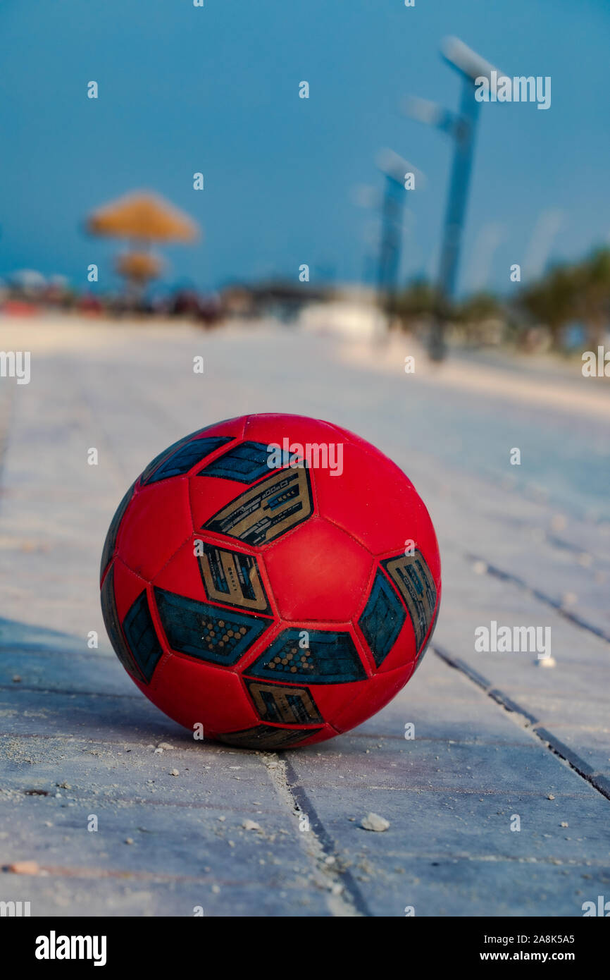 Soccer football on beach - Image Stock Photo - Alamy