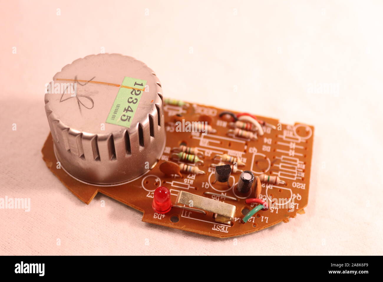 The circuit board of a Kiddie Smoke Detector circa 2007 Stock Photo