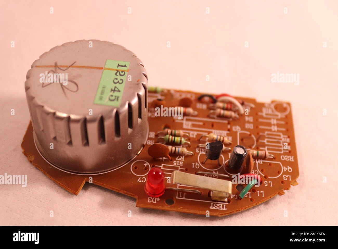 The circuit board of a Kiddie Smoke Detector circa 2007 Stock Photo