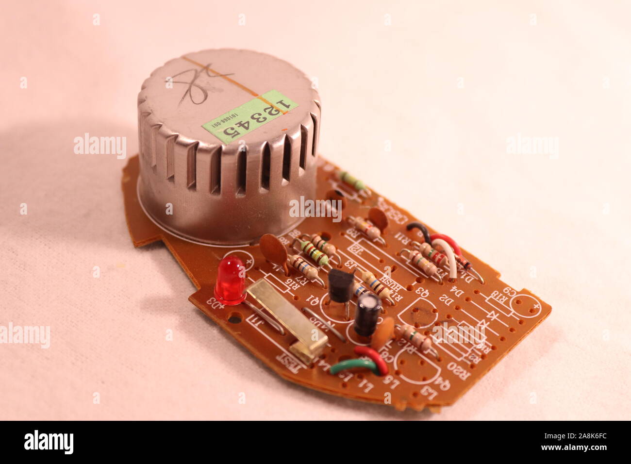 The circuit board of a Kiddie Smoke Detector circa 2007 Stock Photo