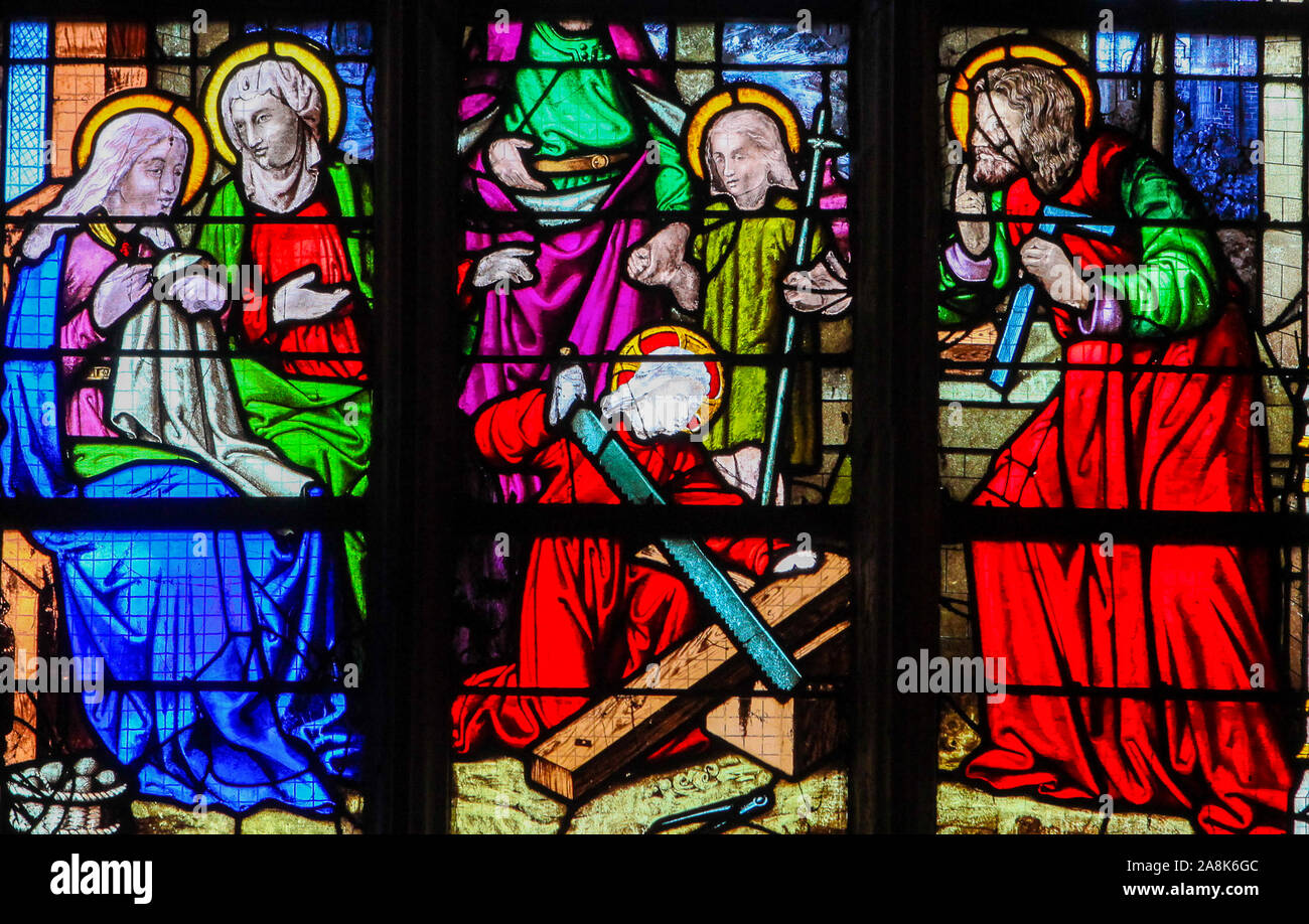 Stained Glass in the Church of St James in Le Treport, France, depicting Jesus as a Carpenter Apprentice, symbolizing Ora et Labore Stock Photo