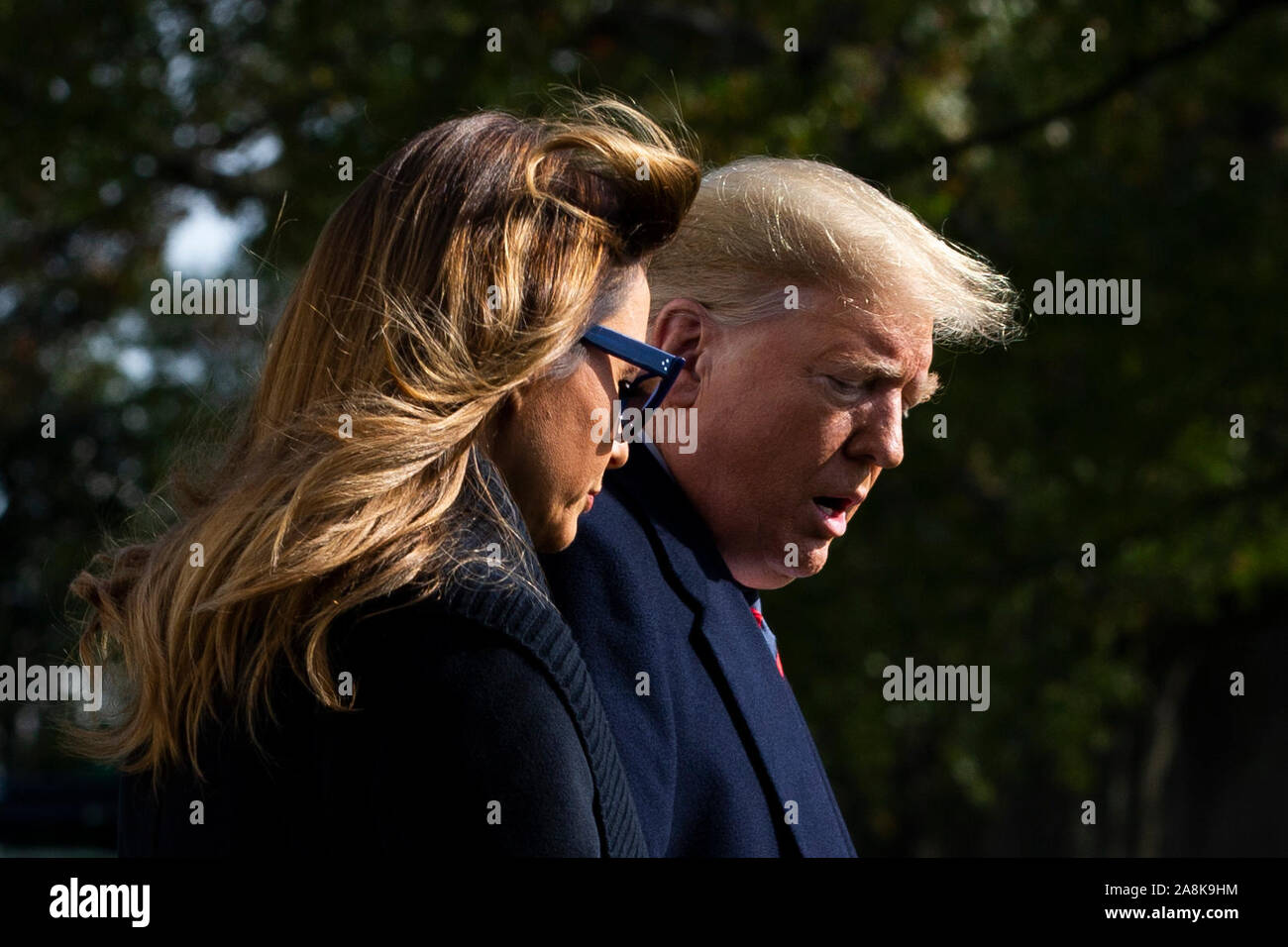 Washington DC, USA. 09th Nov, 2019. US President Donald J. Trump (R) and First Lady Melania Trump (L) walk aross the South Lawn of the White House to depart by Marine One in Washington, DC, USA, 09 November 2019. The President and First Lady will attend a National Collegiate Athletic Association (NCAA) football game between Alabama and Louisiana State University in Tuscaloosa, Alabama; then they will stay in New York City through Veterans Day. Credit: MediaPunch Inc/Alamy Live News Stock Photo