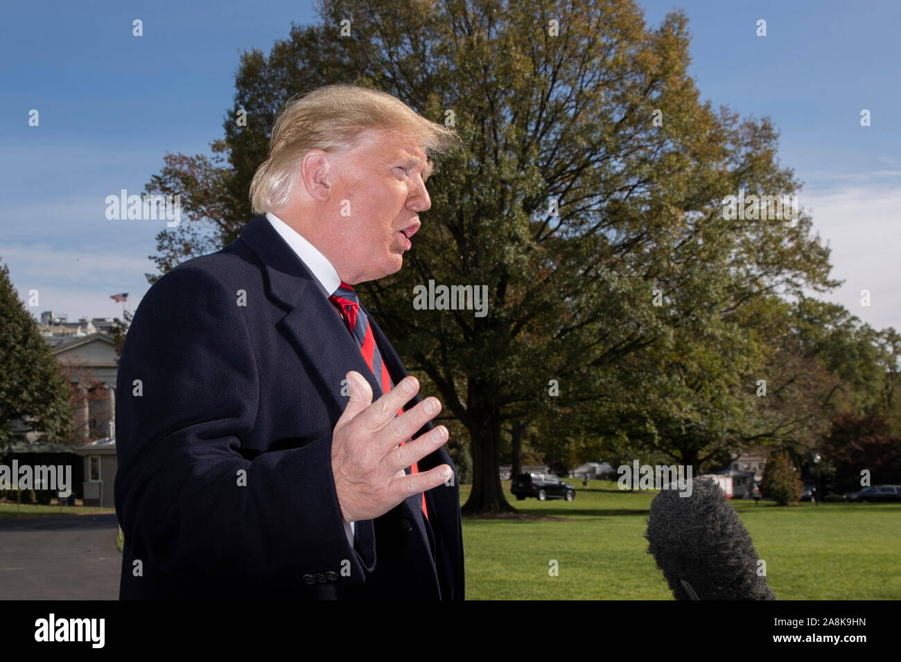 Washington DC, USA. 09th Nov, 2019. US President Donald J. Trump delivers brief remarks to members of the news media before departing with First Lady Melania Trump (not pictured) on the South Lawn of the White House in Washington, DC, USA, 09 November 2019. The President and First Lady will attend a National Collegiate Athletic Association (NCAA) football game between Alabama and Louisiana State University in Tuscaloosa, Alabama; then they will stay in New York City through Veterans Day. Credit: MediaPunch Inc/Alamy Live News Stock Photo