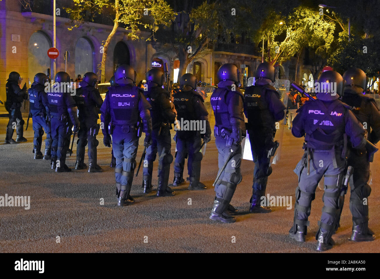 A group of Spanish national riot police stand alert during the protest.About 500 people called by the Defence Committees of the Republic (CDR) march of reflection for the general elections in the protest of 1-O ruling. Stock Photo