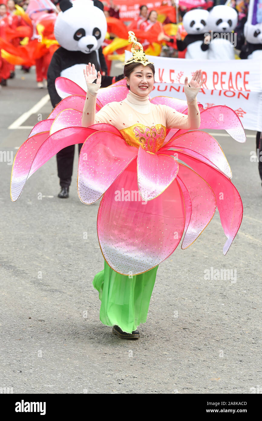 A woman in a flower costume taking part during The Lord Mayor's Show in  London.The traditional yearly procession brings together over 6,500 people,  120 horses and over 60 decorated floats in a