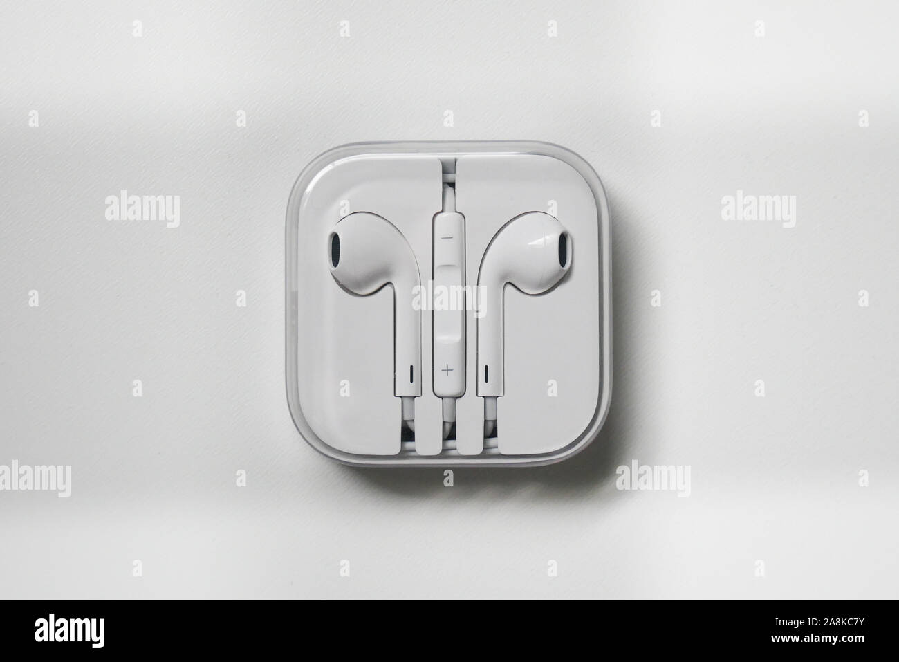 white apple wred head phones came with iphone6 Stock Photo