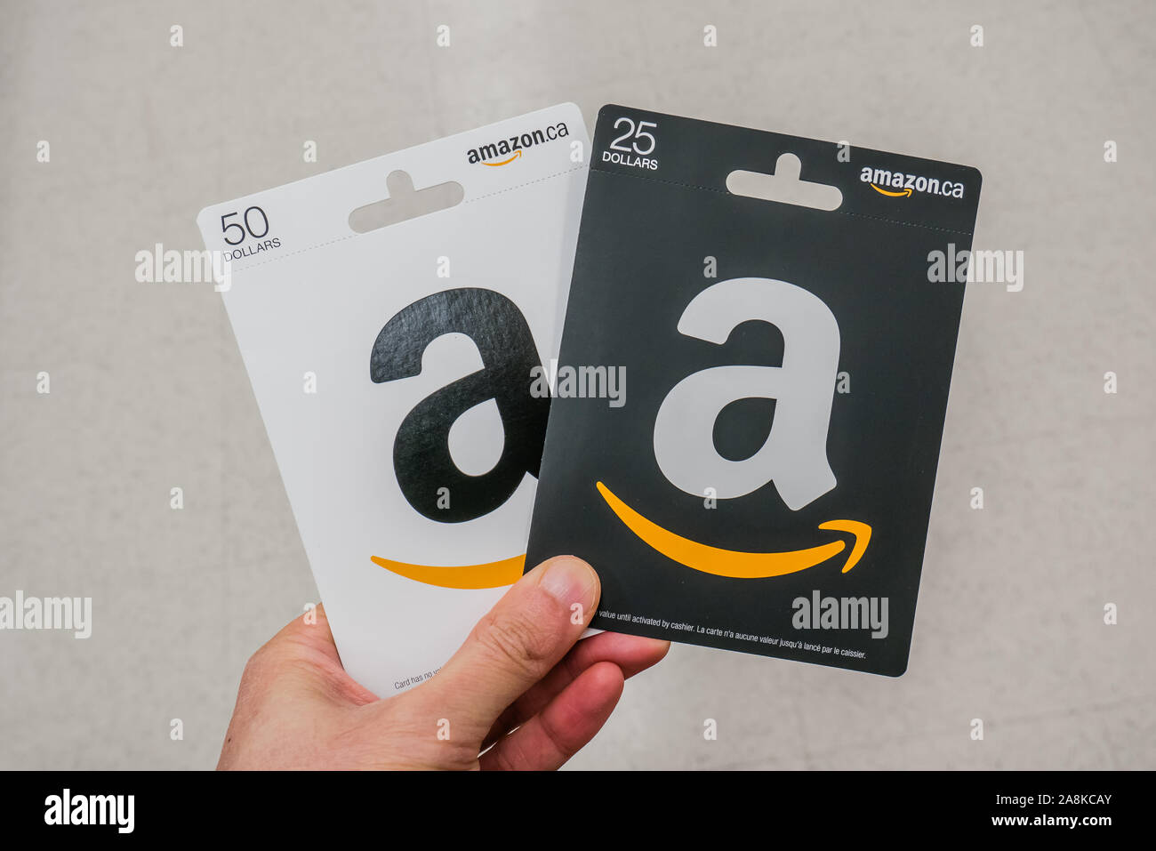 hand holding amazon gift cards Stock Photo - Alamy