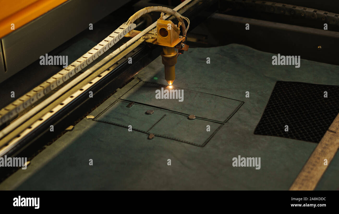 Laser cutting beam artificial leather High precision. Modern machine