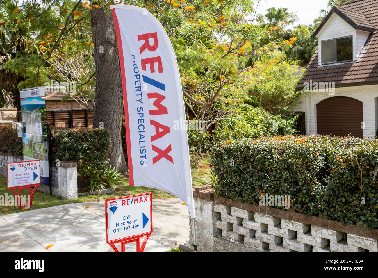 Australian home in Sydney for sale by auction with real estate marketing signs outside,Sydney,Australia Stock Photo