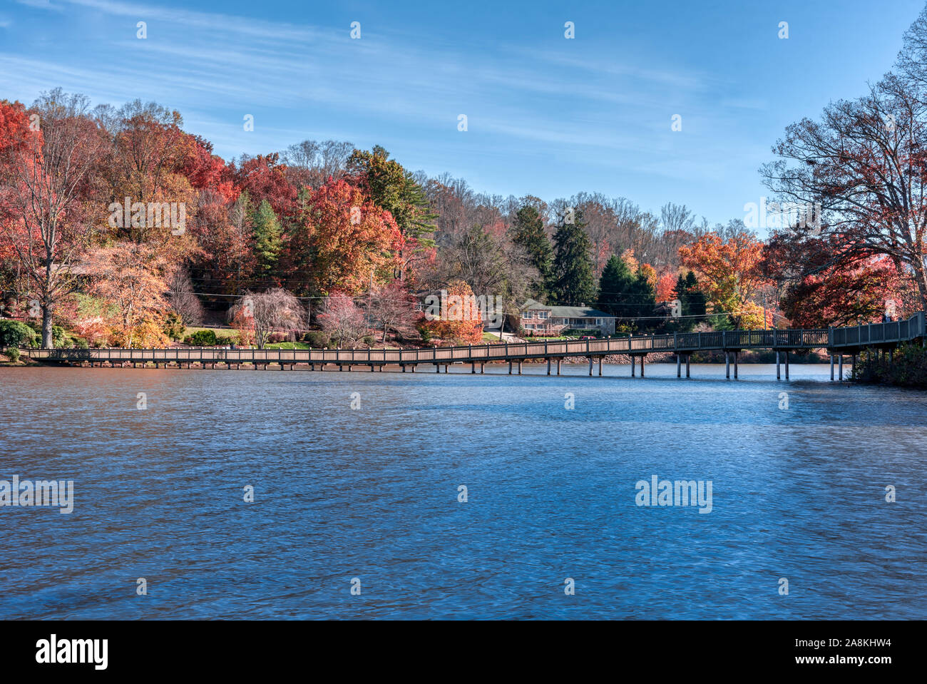 Fall Landscape showing Lake houses with reflections in Lake Junaluska Stock Photo