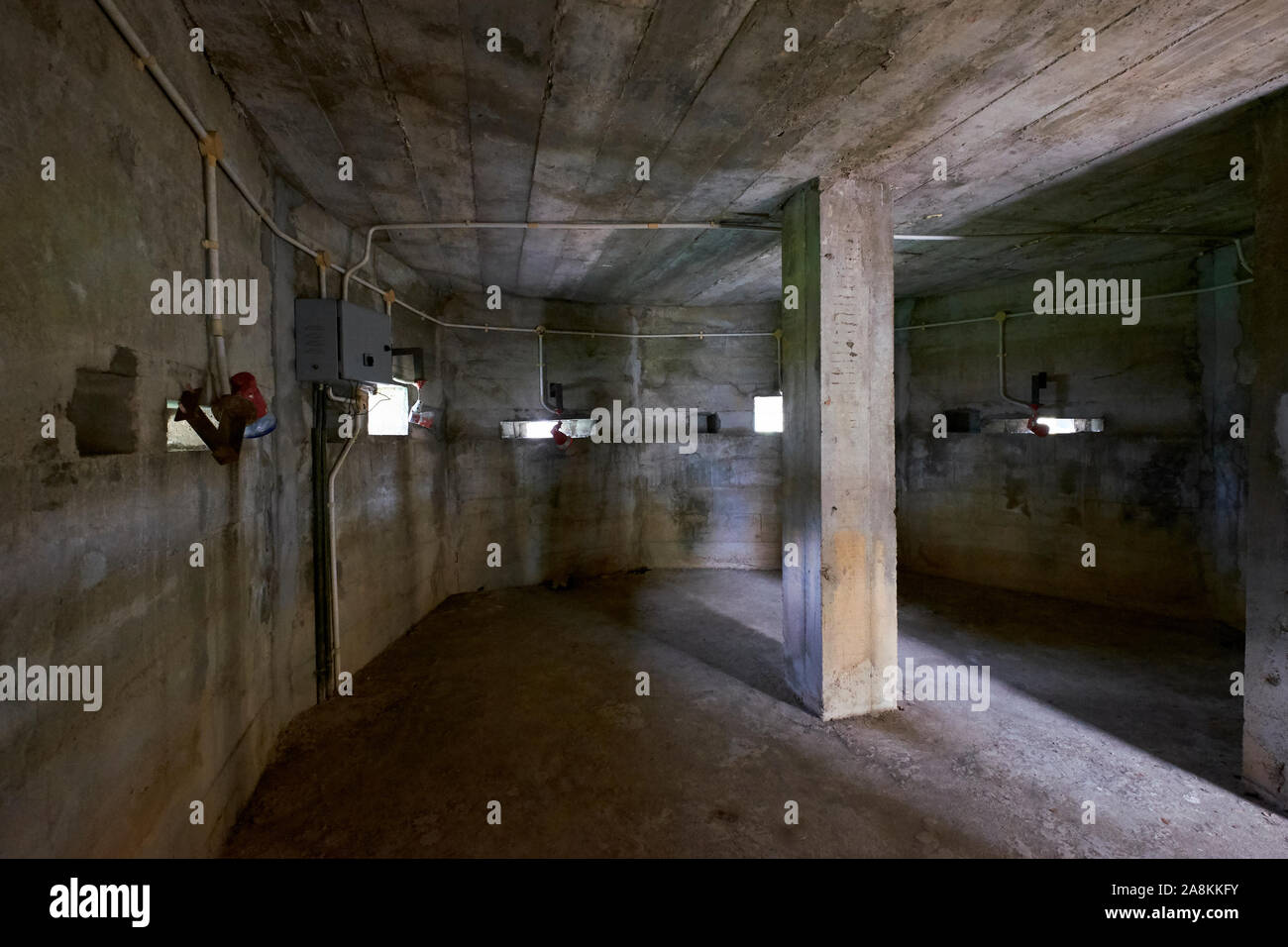 Inside a replica of a concrete bunker, pillbox at the World War II