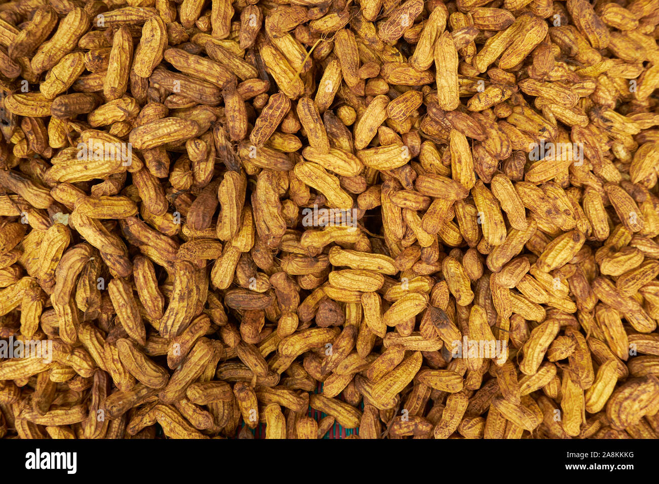 A closeup of yellow peanuts. Good for a computer, phone wallpaper, desktop, background, screensaver. In Kota Bharu, Kelantan, Malaysia. Stock Photo