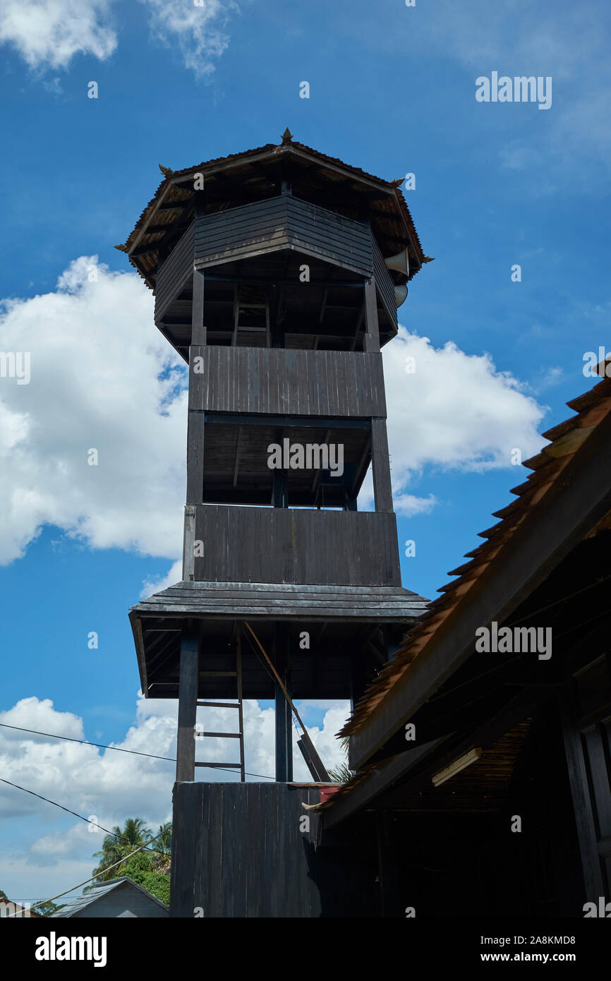The minaret of the oldest mosque in Malaysia, Kampong Laut. It's made completely of wood and tile, using no nails. In Kota Bharu, Kelantan, Malaysia. Stock Photo