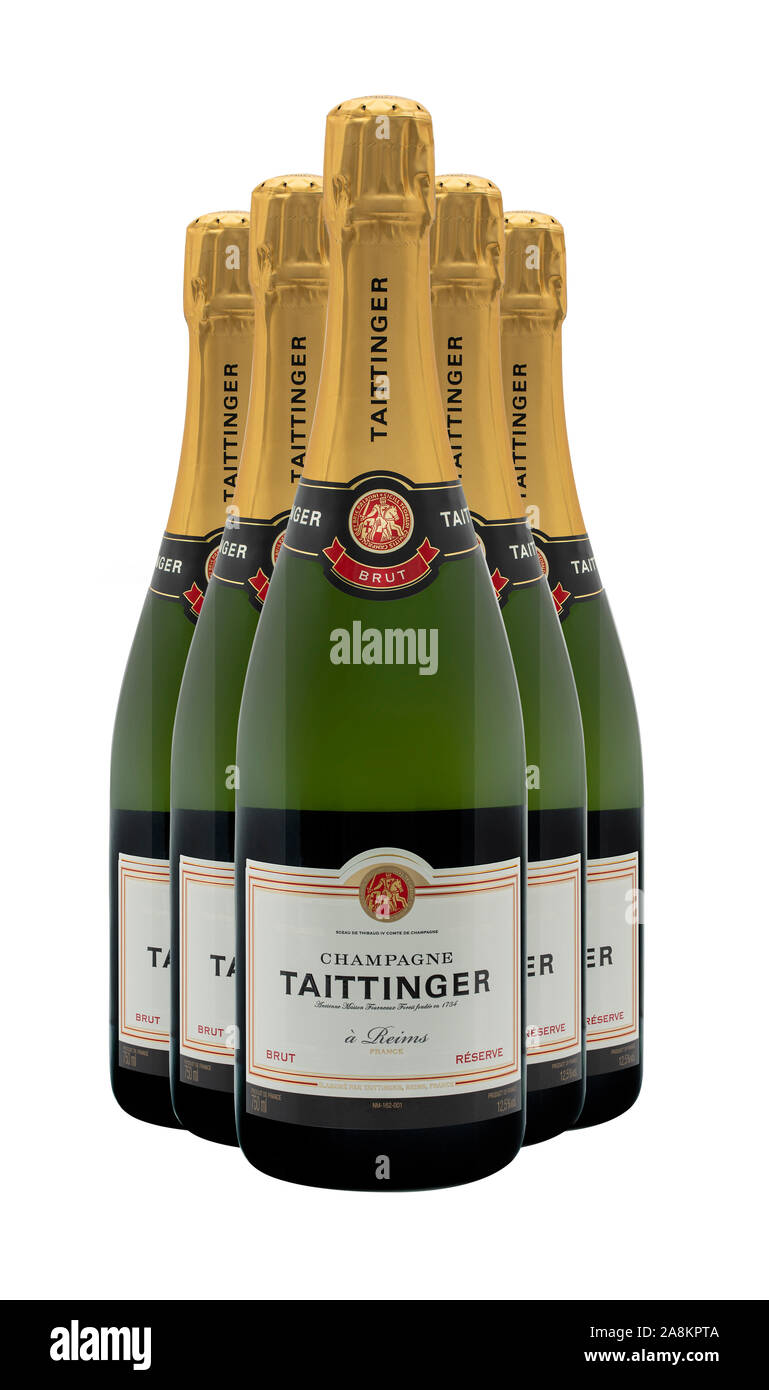 SWINDON, UK - November 9, 2019: Five Bottles of Taittinger Brut Champagne on a white background, Stock Photo