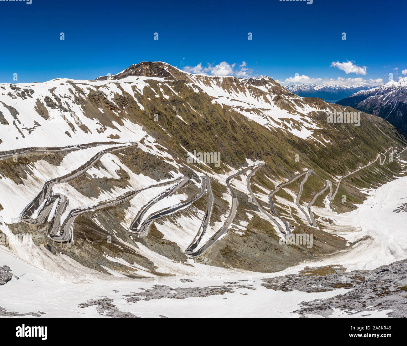 Winding road at the top of the Stelvio pass in the alps near Bormio in Italy Stock Photo