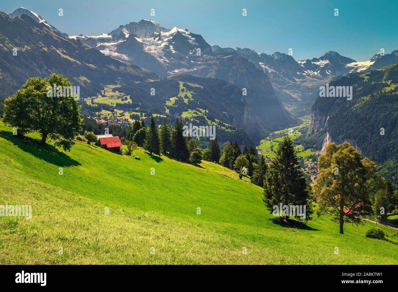 Beautiful spring alpine places with meadows and snowy mountains
