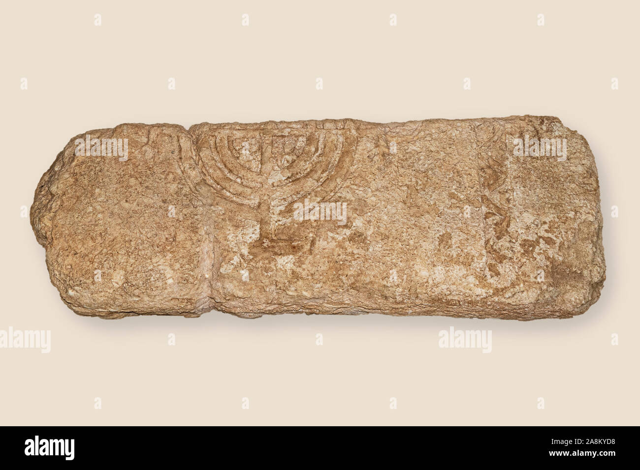 ancient talmudic era carved limestone lintel clearly showing a jewish menorah candelabra from a synagogue at horvat kishor in israel Stock Photo