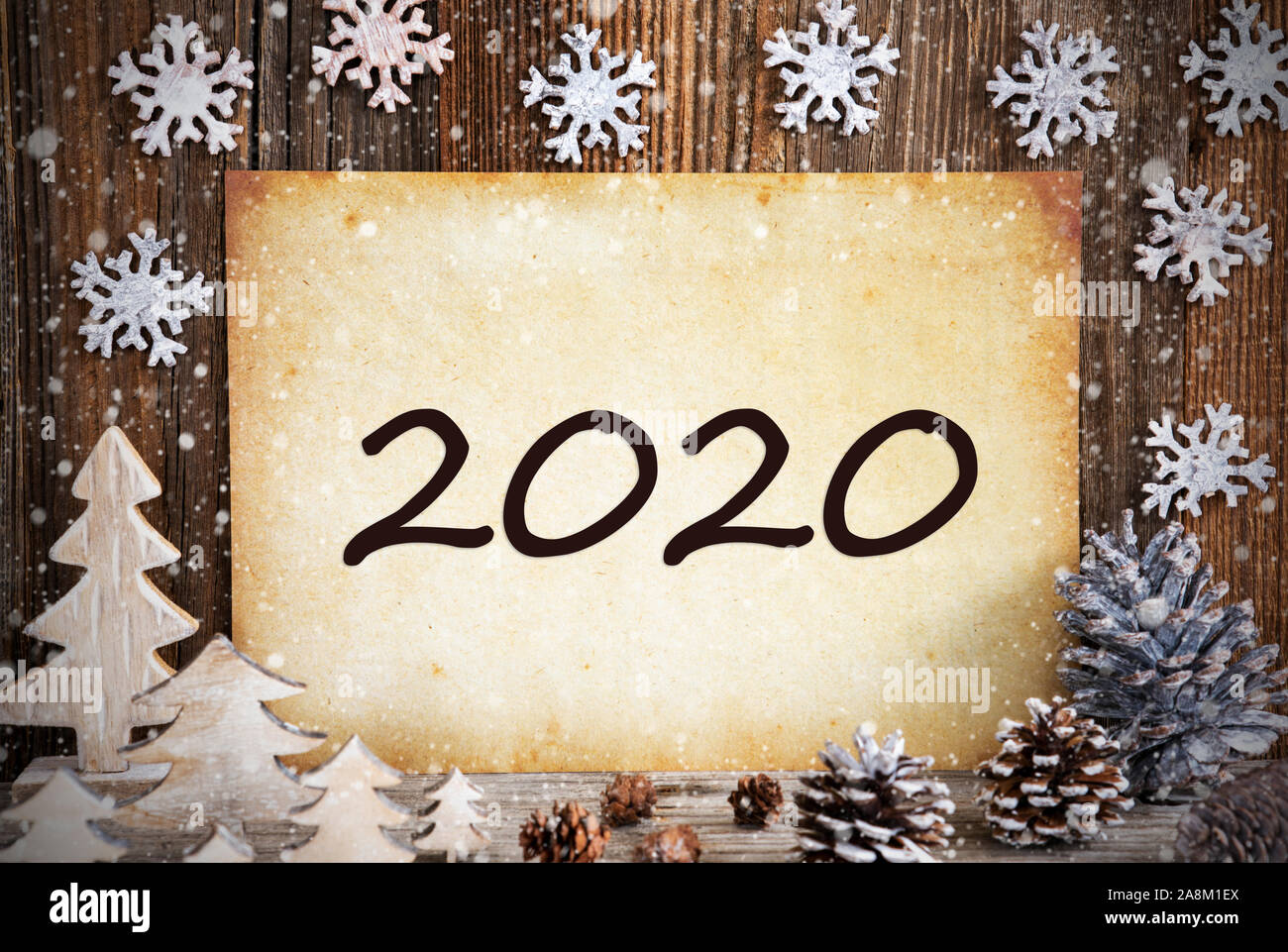 Old Paper With Christmas Decoration, Text 2020, Snowflakes Stock Photo