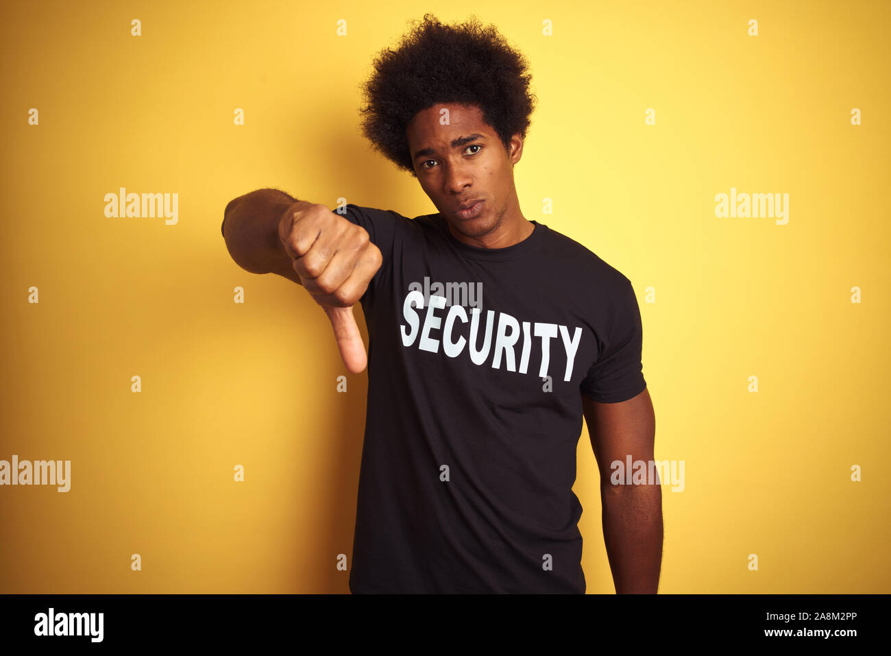American safeguard man with afro hair wearing security uniform over ...