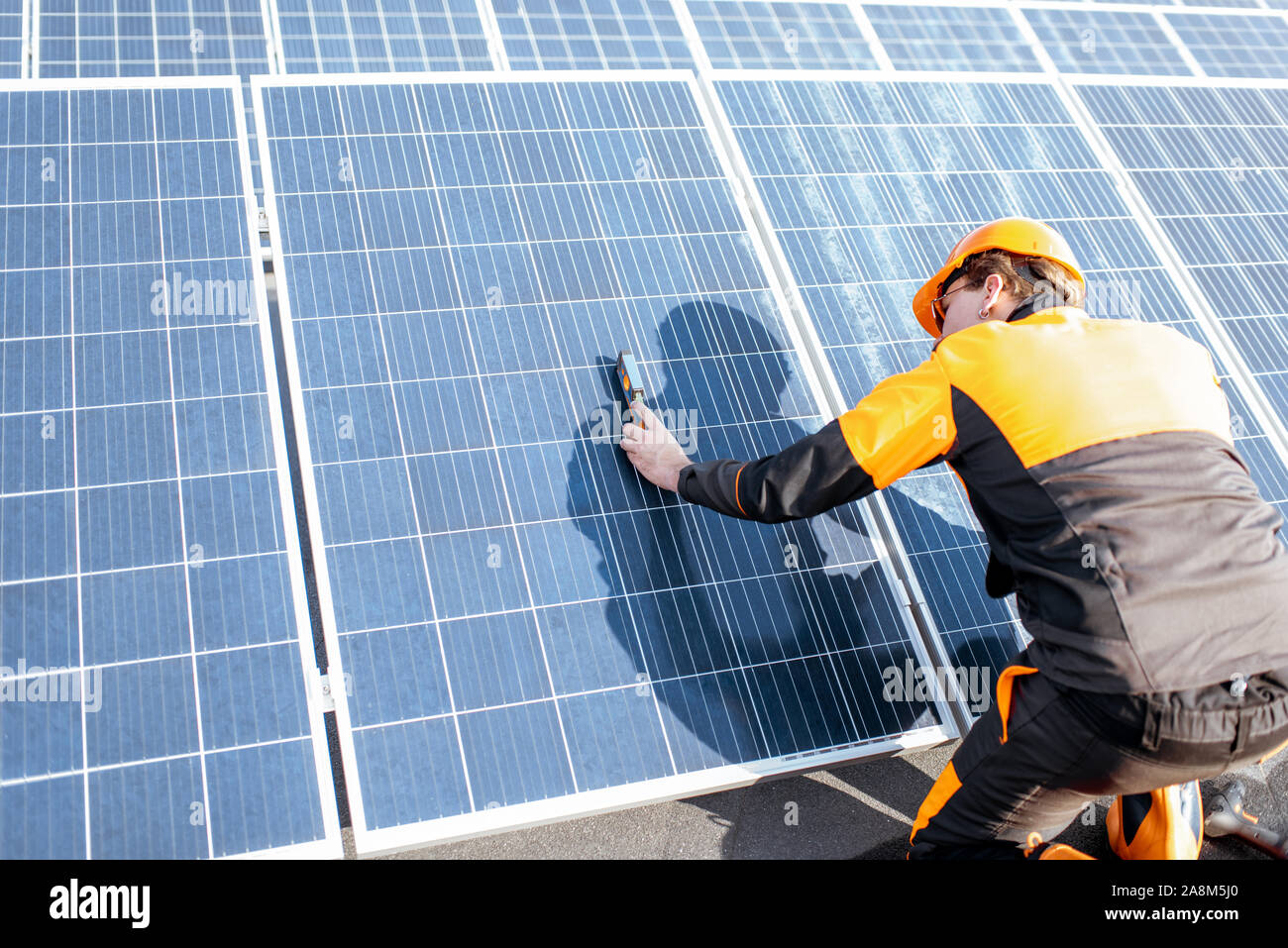 Technician in solar plant hi-res stock photography and images - Alamy