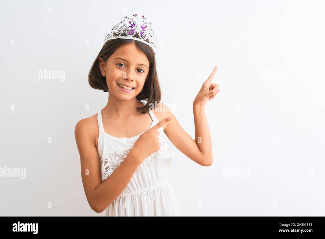 beautiful-child-girl-wearing-princess-crown-standing-over-isolated