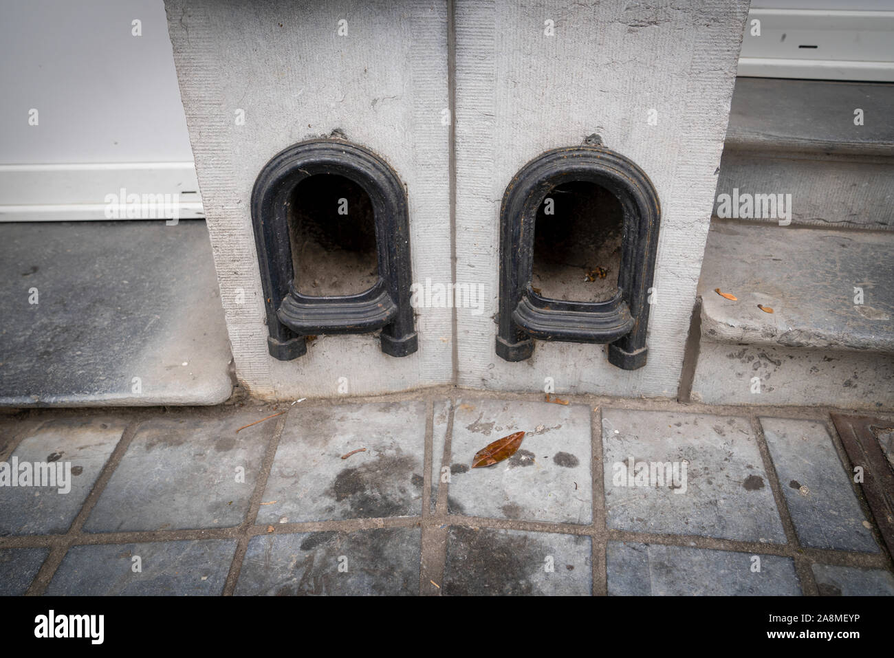 Boot scraper in a low wall at the entrance to the drive of a terraced ...