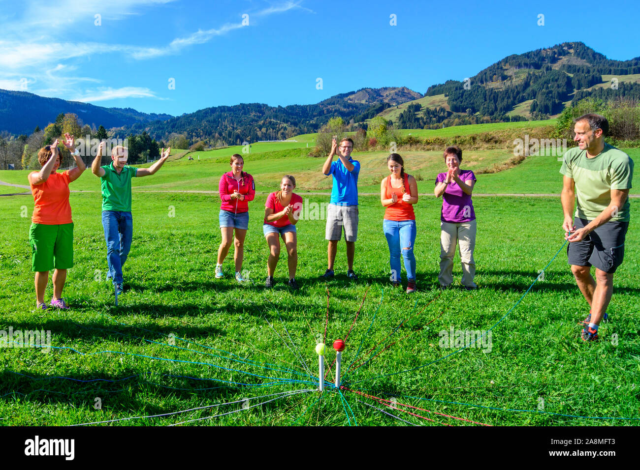 Teambuilding exercise called ball transport complex Stock Photo Alamy