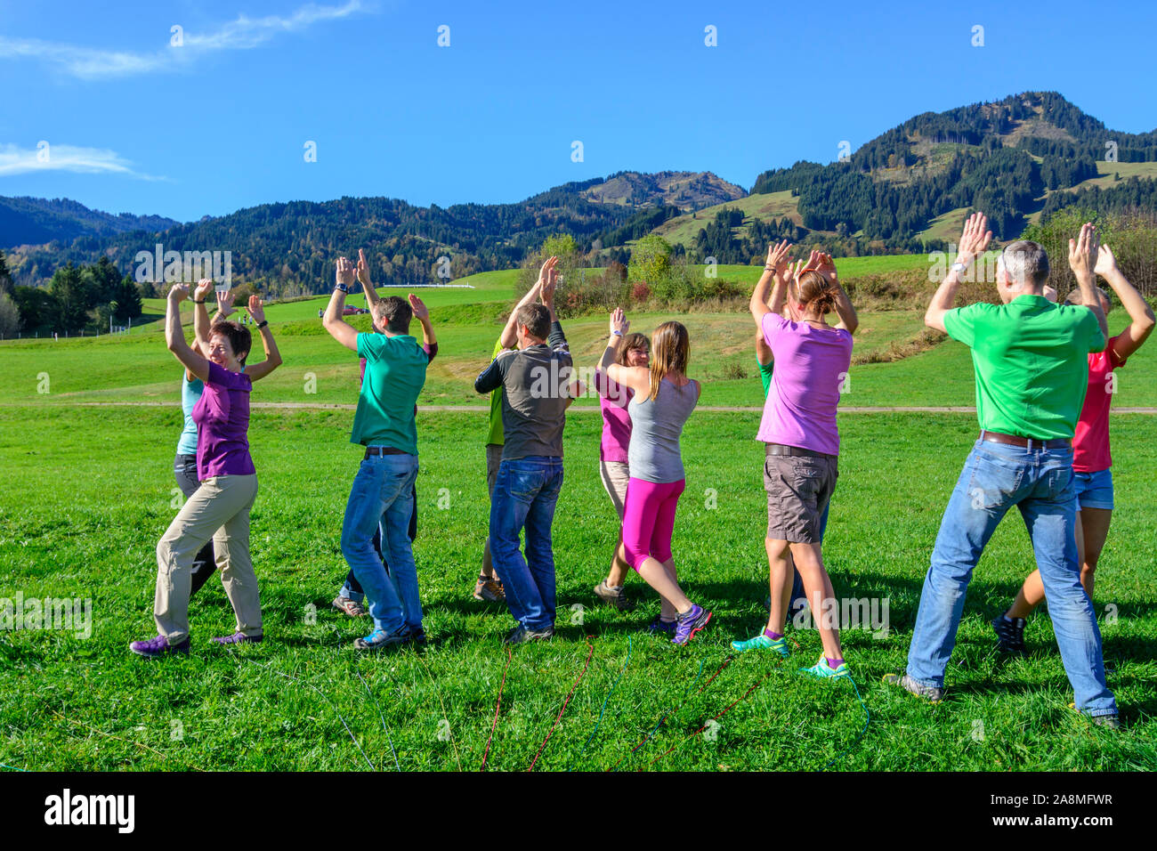 Teambuilding exercise called ball transport Stock Photo Alamy