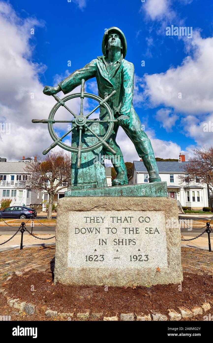 Bronze statue of a man at the wheel, Gloucester fisherman's Memorial, Memorial for castaways with inscription from biblical Psalm, Gloucester, Cape Stock Photo