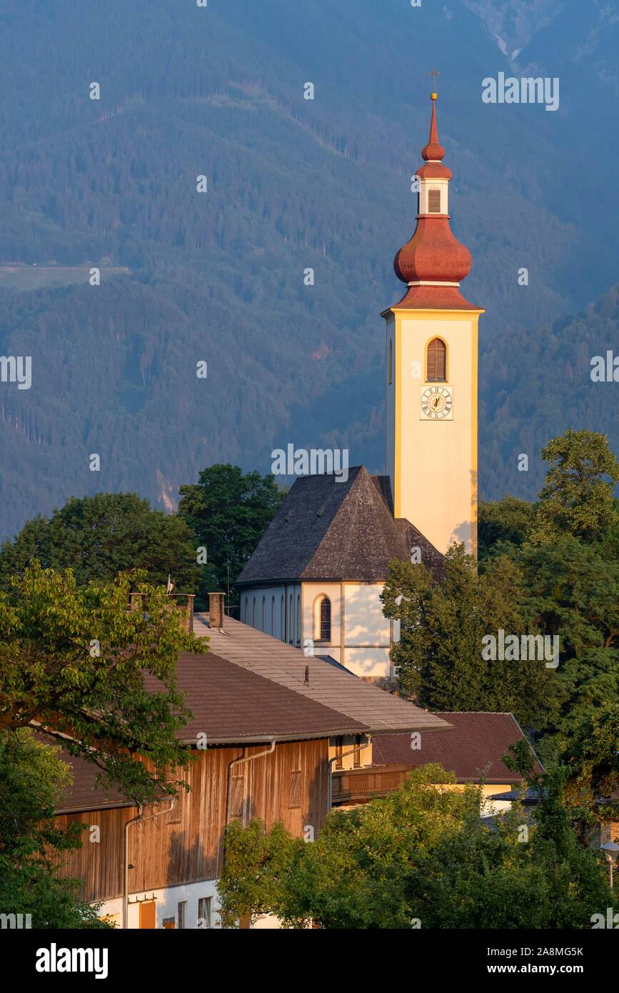 Parish church St. Margarethen in the first morning light, Buch in Tyrol, Tyrol, Austria Stock Photo