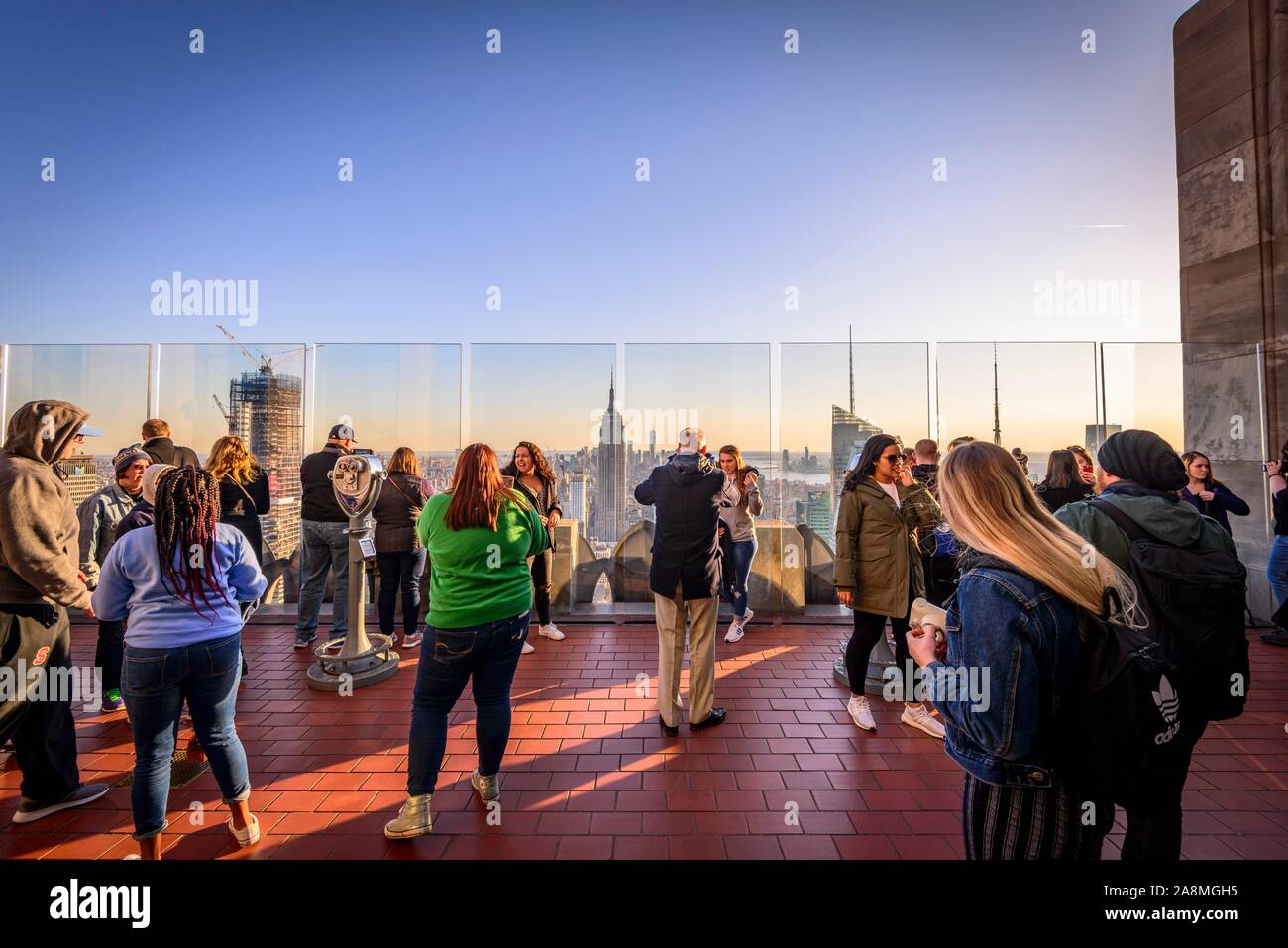 Tourists on viewing platform overlooking Midtown and Downtown Manhattan and Empire State Building, Top of the Rock Observation Center, Rockefeller Stock Photo