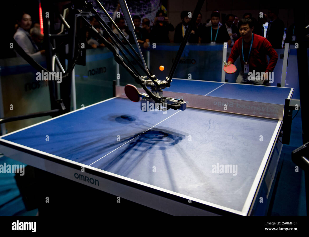 Shanghai, China. 9th Nov, 2019. A visitor plays table tennis with Omron's Forpheus during the second China International Import Expo (CIIE) in Shanghai, east China, Nov. 9, 2019. The robot displayed in the CIIE is the 5th generation of Forpheus. Credit: Purbu Zhaxi/Xinhua/Alamy Live News Stock Photo