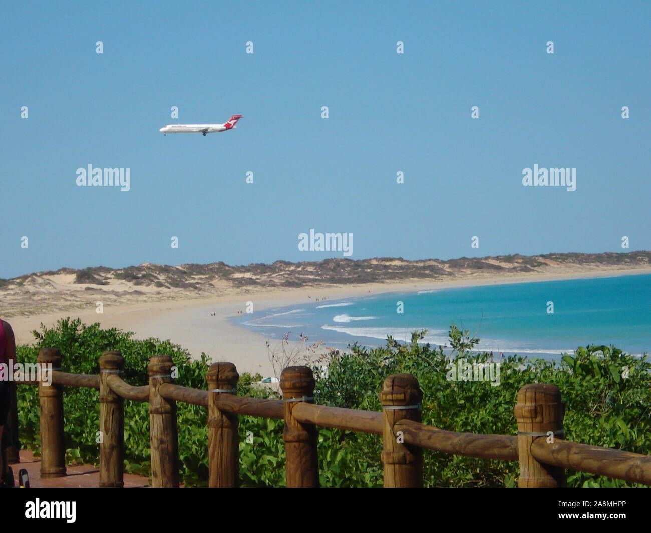 Airplane Landing over Beach Stock Photo