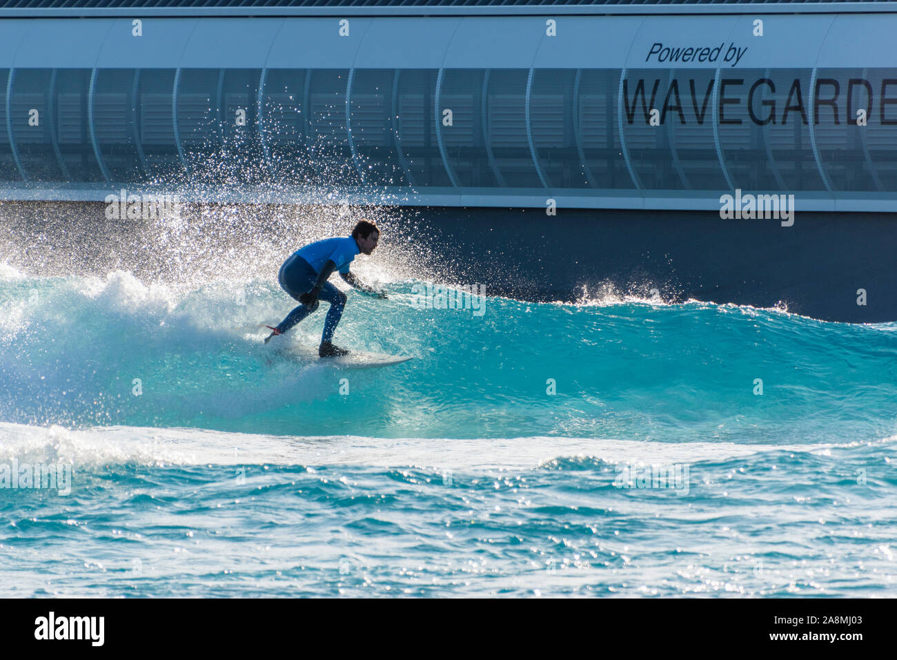 Surfer riding advanced level waves at The wave, Bristol, an artificial inland surfing lake near Bristol, UK. Stock Photo
