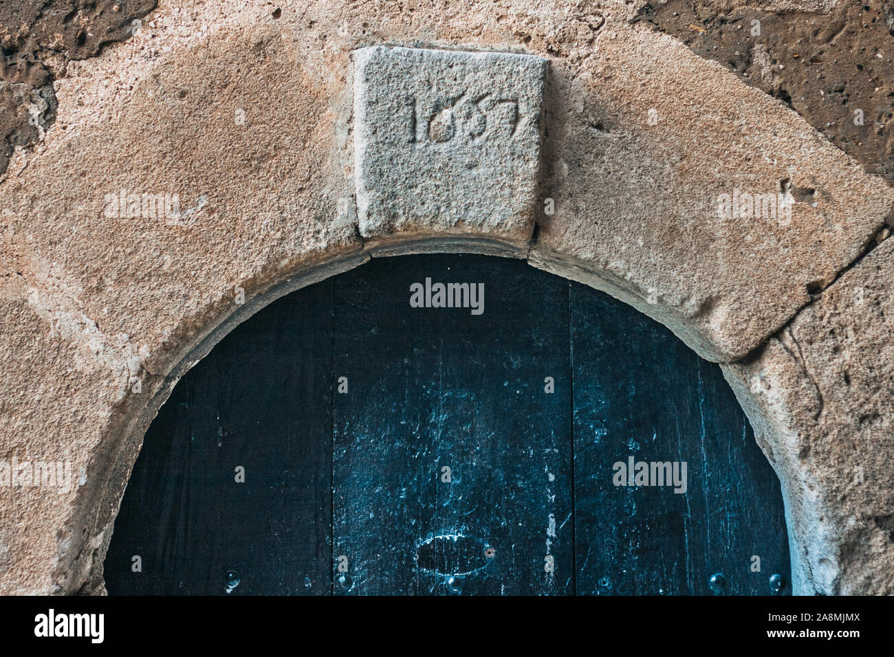 Ancient wooden door in a stone house Stock Photo - Alamy